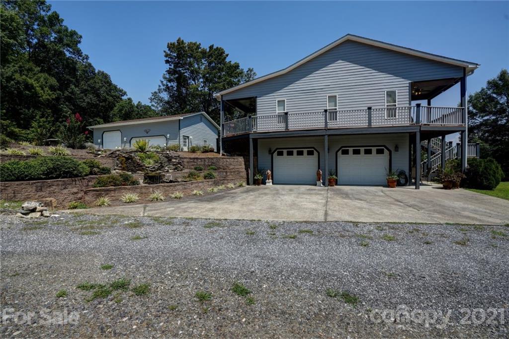 280 Robinson Gap Road Bryson City, NC 28713 - Photo 3 of 36 a front view of a house with a yard