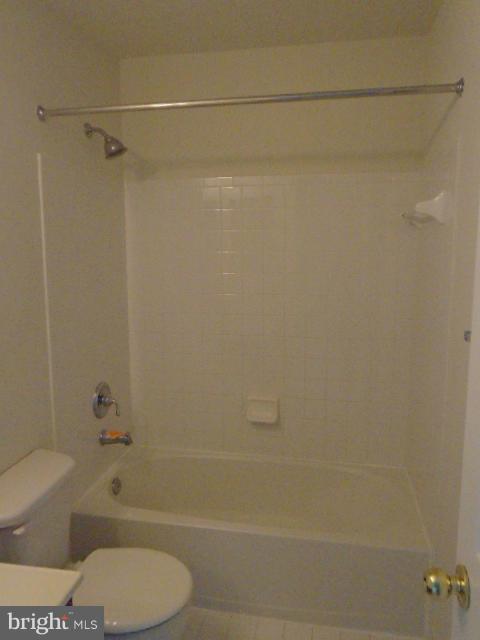 9718 Luguna Road Middle River, MD 21220 - Photo 16 of 29 a bathroom with a shower a toilet and a bathtub