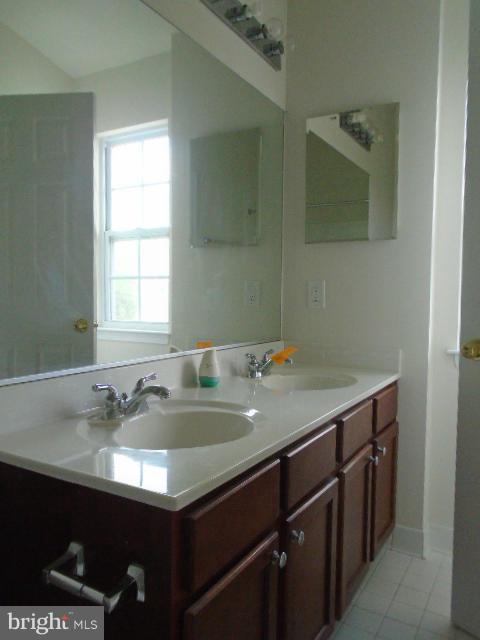 9718 Luguna Road Middle River, MD 21220 - Photo 20 of 29 a bathroom with a sink and a mirror
