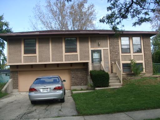 416 Rockhurst Road Bolingbrook, IL 60440 - Photo 1 of 1 a car parked in front of a house