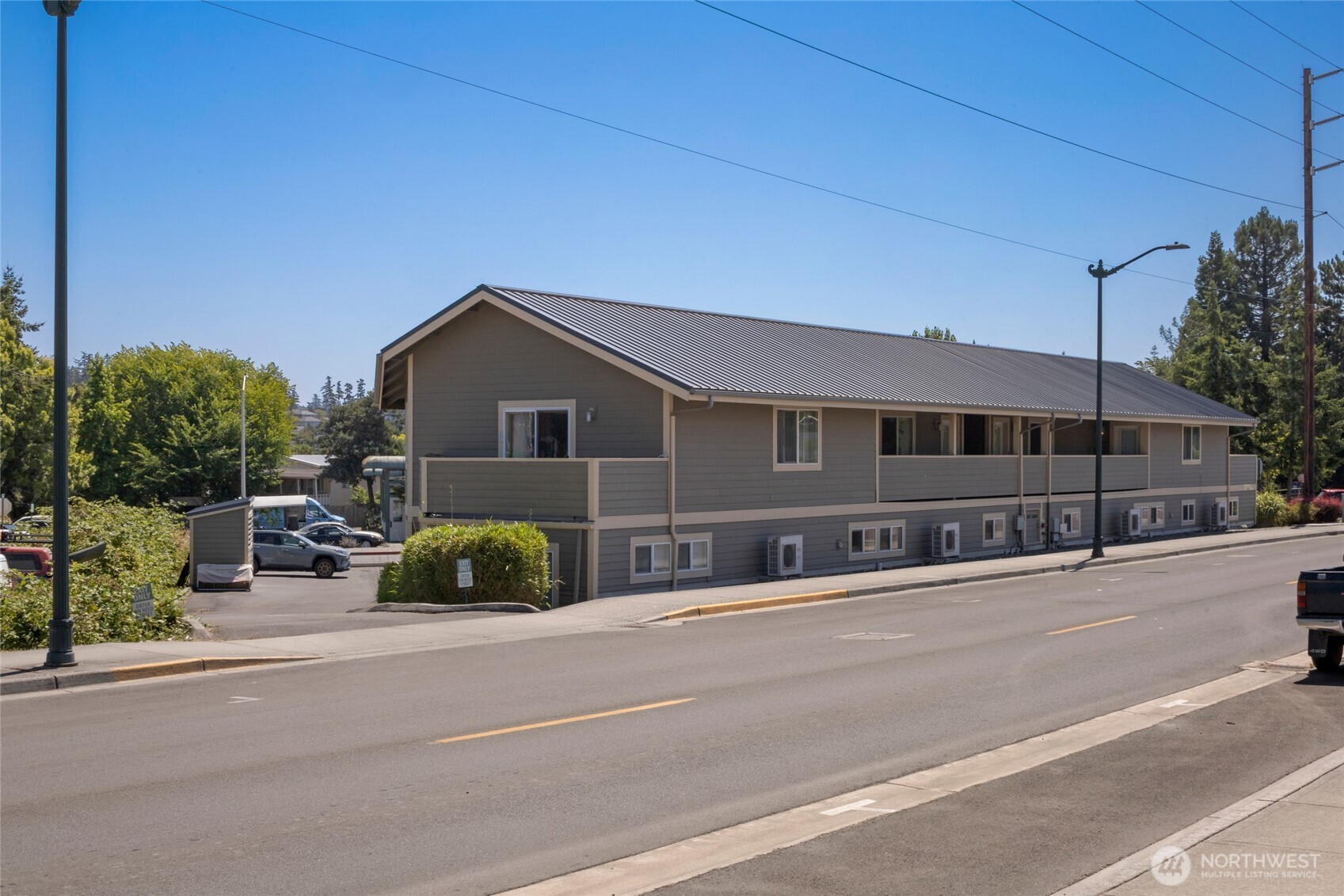 470 Reed Street, Unit 2 Friday Harbor, WA 98250 - Photo 13 of 29 a front view of a house with a garden