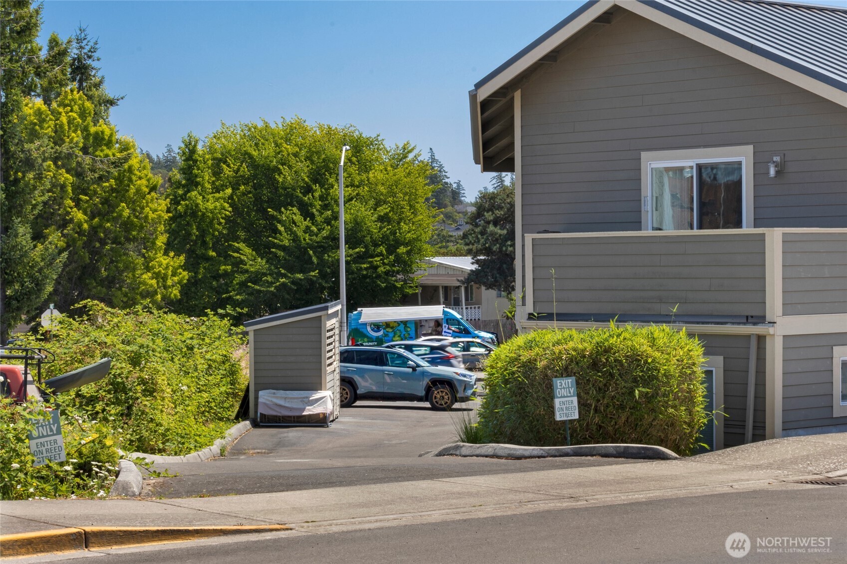 470 Reed Street, Unit 2 Friday Harbor, WA 98250 - Photo 15 of 29 a view of a house with a garden