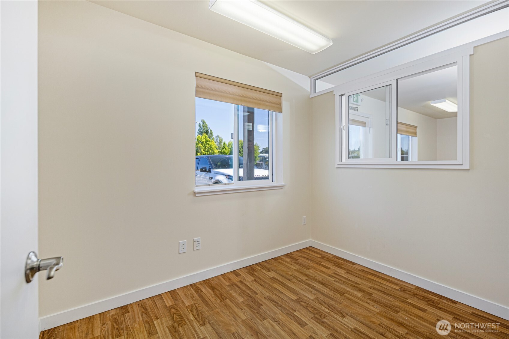 470 Reed Street, Unit 2 Friday Harbor, WA 98250 - Photo 21 of 29 wooden floor in an empty room with a window