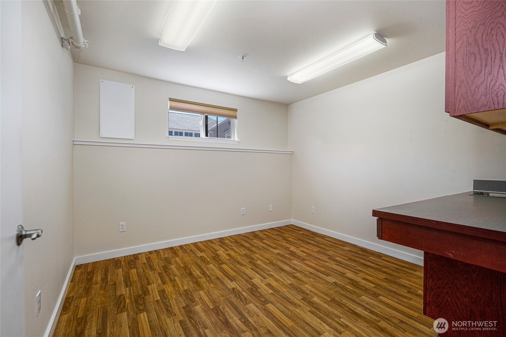 470 Reed Street, Unit 2 Friday Harbor, WA 98250 - Photo 24 of 29 a view of a room with wooden floor and cabinet