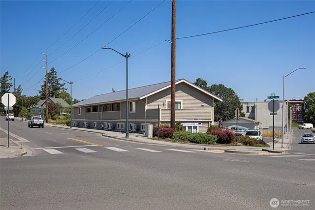 a view of a street next to a building