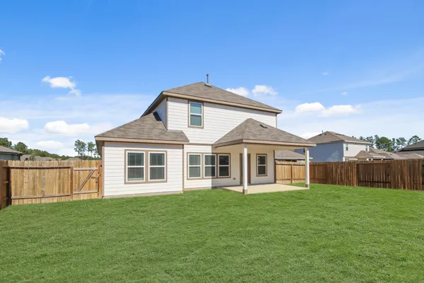 a view of front of house with a yard