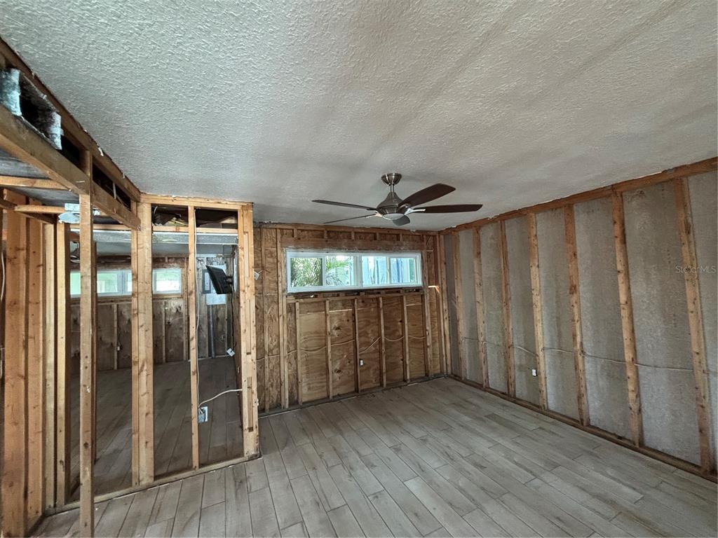 2985 North Beach Road, Unit C71 Englewood, FL 34223 - Photo 12 of 23 a view of entryway with wooden floor