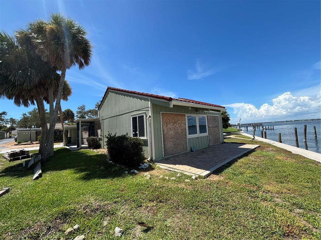 2985 North Beach Road, Unit C71 Englewood, FL 34223 - Photo 16 of 23 a house view with a garden space