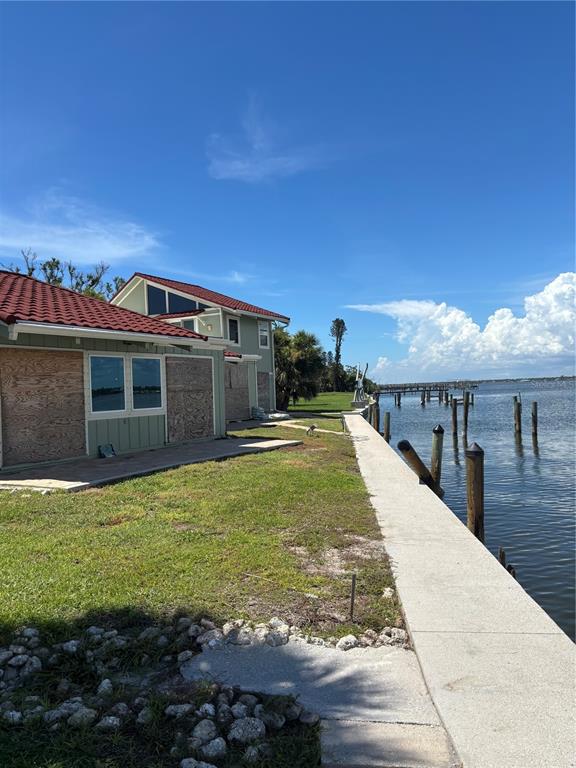 2985 North Beach Road, Unit C71 Englewood, FL 34223 - Photo 4 of 23 a view of a house with a yard