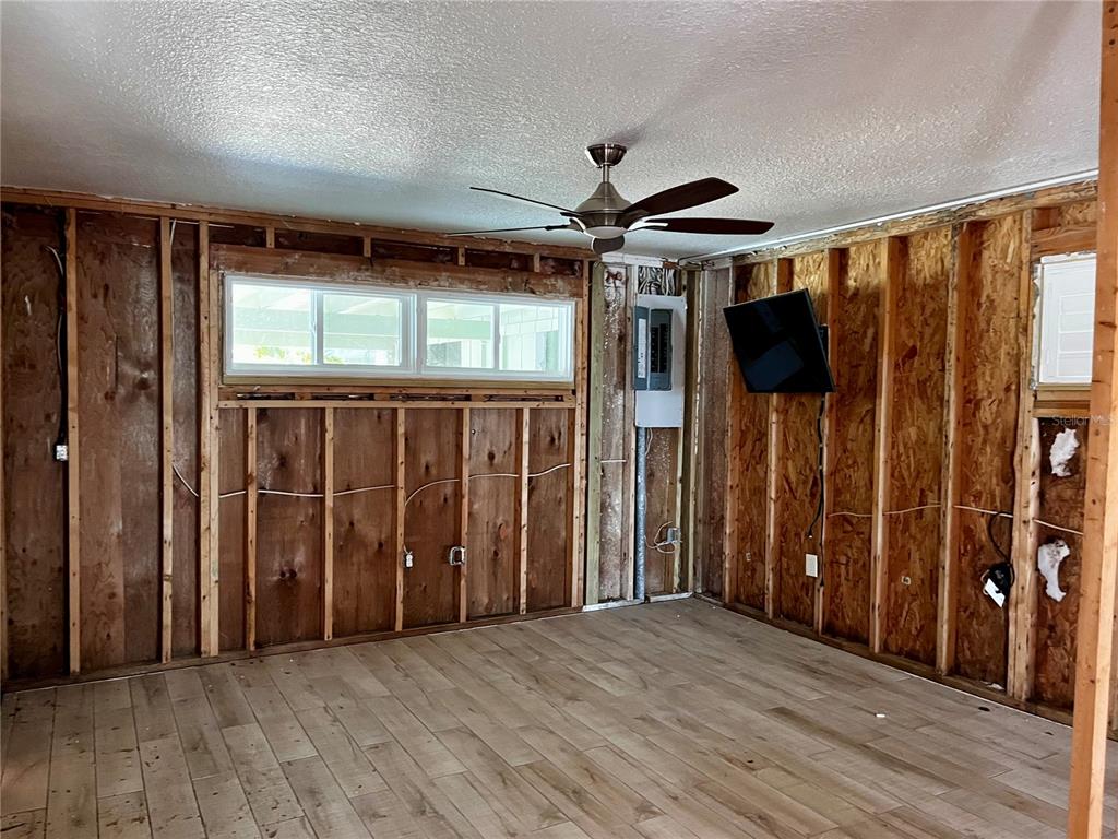 2985 North Beach Road, Unit C71 Englewood, FL 34223 - Photo 8 of 23 wooden floor in an empty room