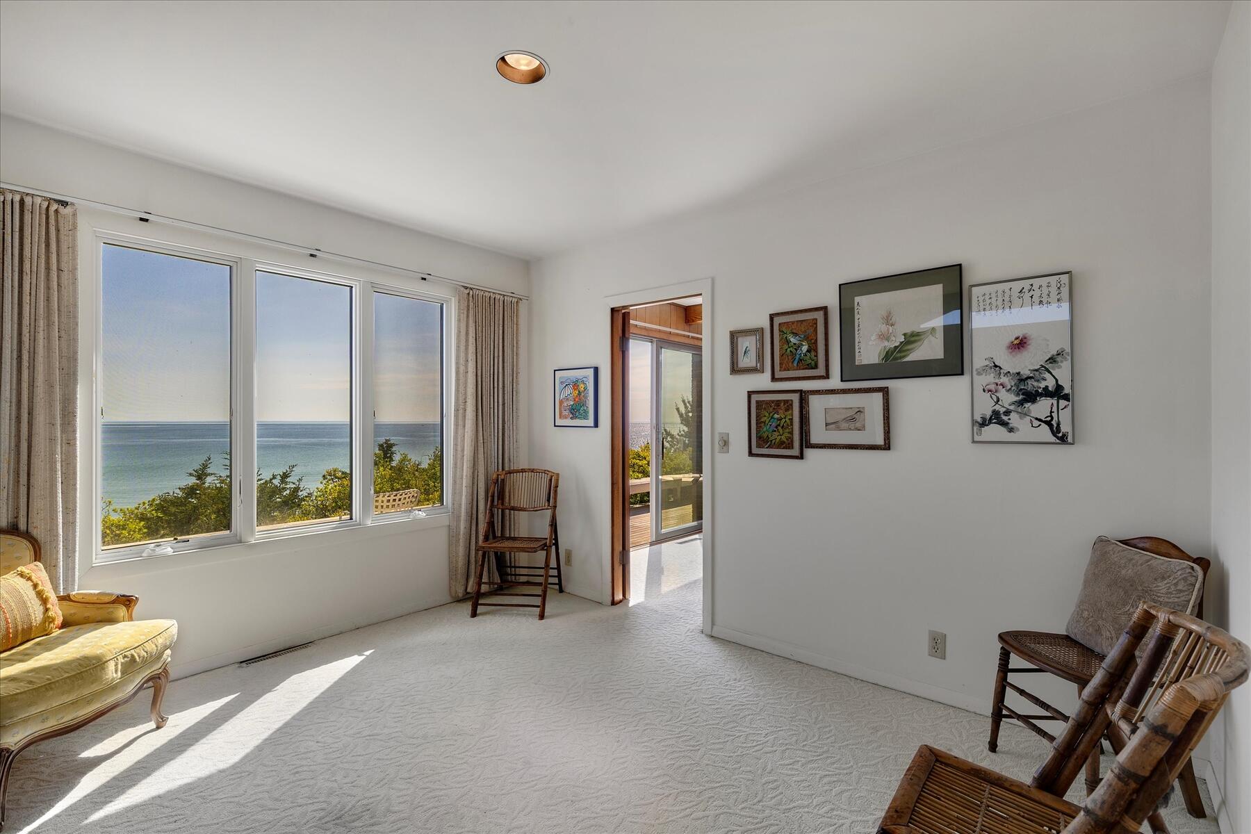 31 Bay View Road Truro, MA 02666 - Photo 11 of 54 a living room with furniture and large window