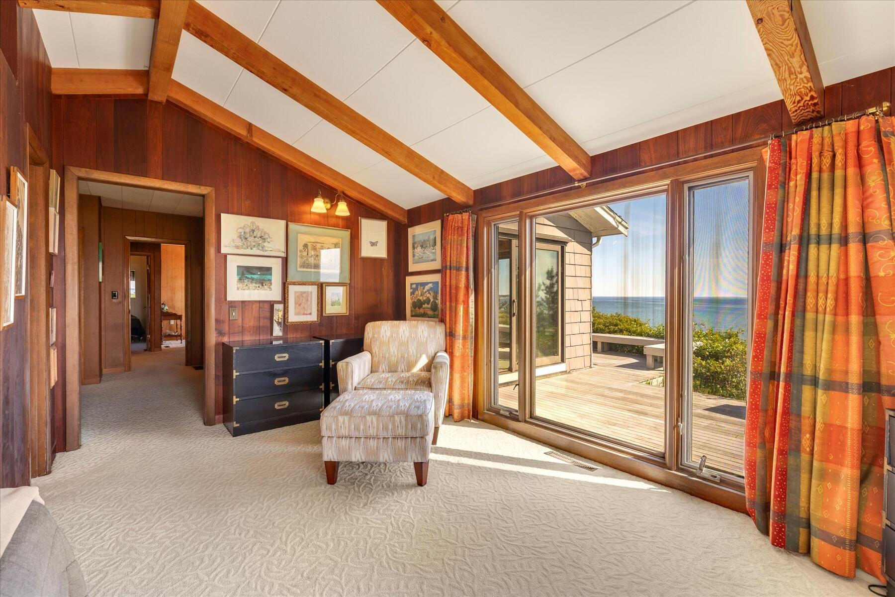 31 Bay View Road Truro, MA 02666 - Photo 18 of 54 a living room with furniture and a floor to ceiling window