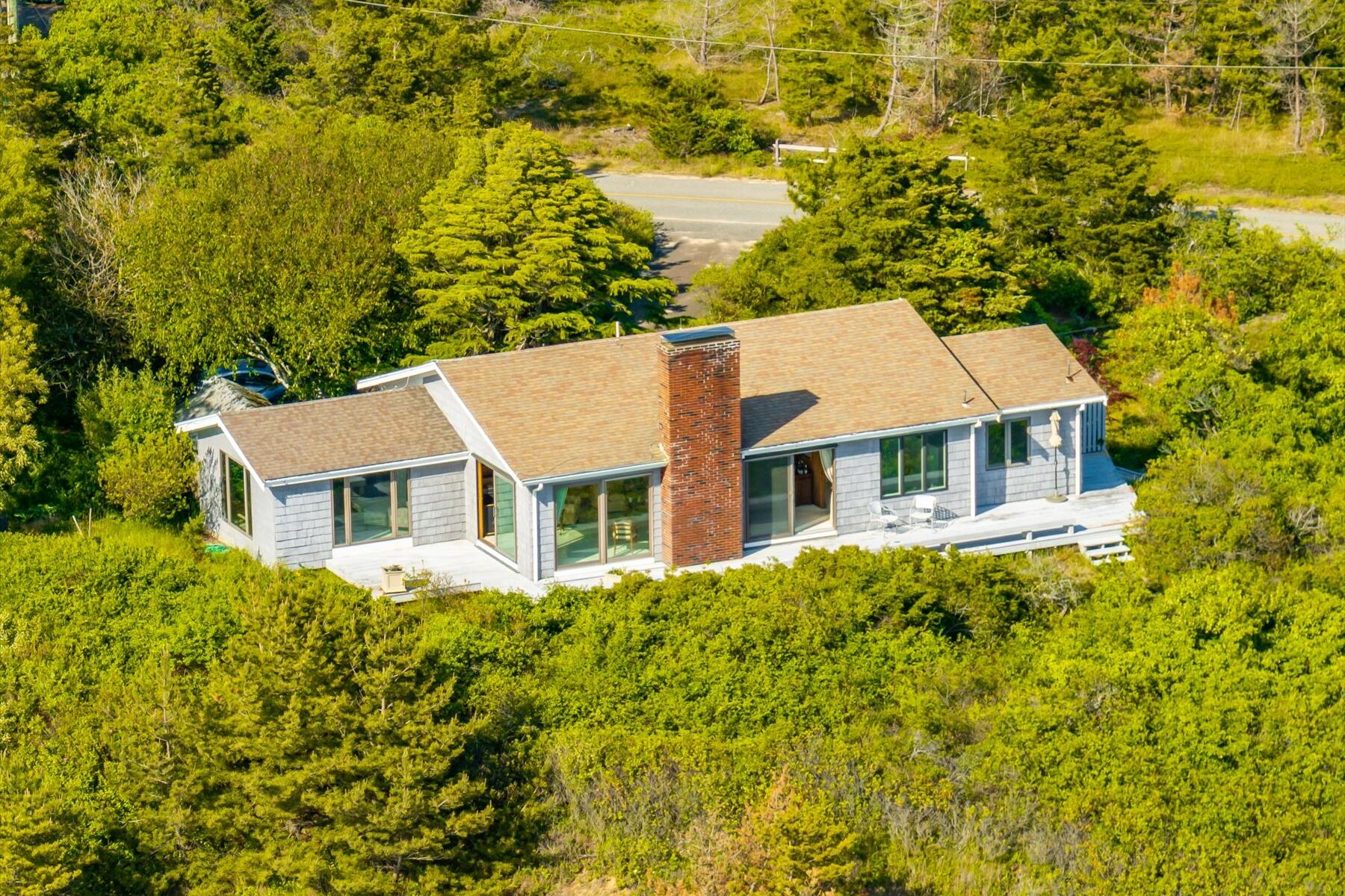 31 Bay View Road Truro, MA 02666 - Photo 37 of 54 a aerial view of a house with a yard and potted plants