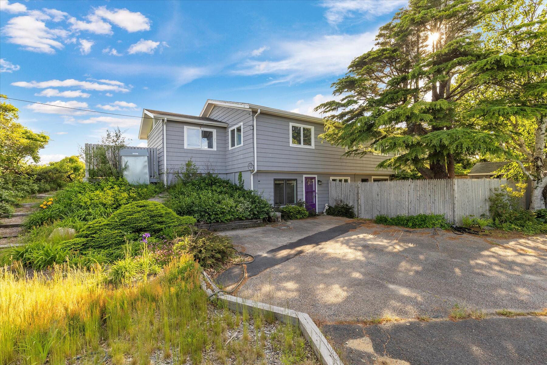 31 Bay View Road Truro, MA 02666 - Photo 41 of 54 a front view of a house with a yard