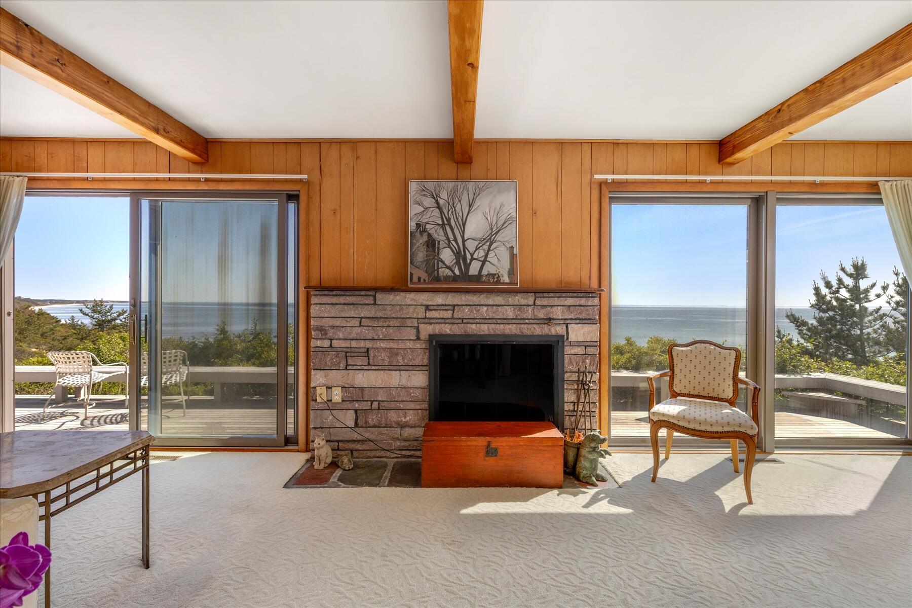31 Bay View Road Truro, MA 02666 - Photo 9 of 54 a living room with furniture and a fireplace