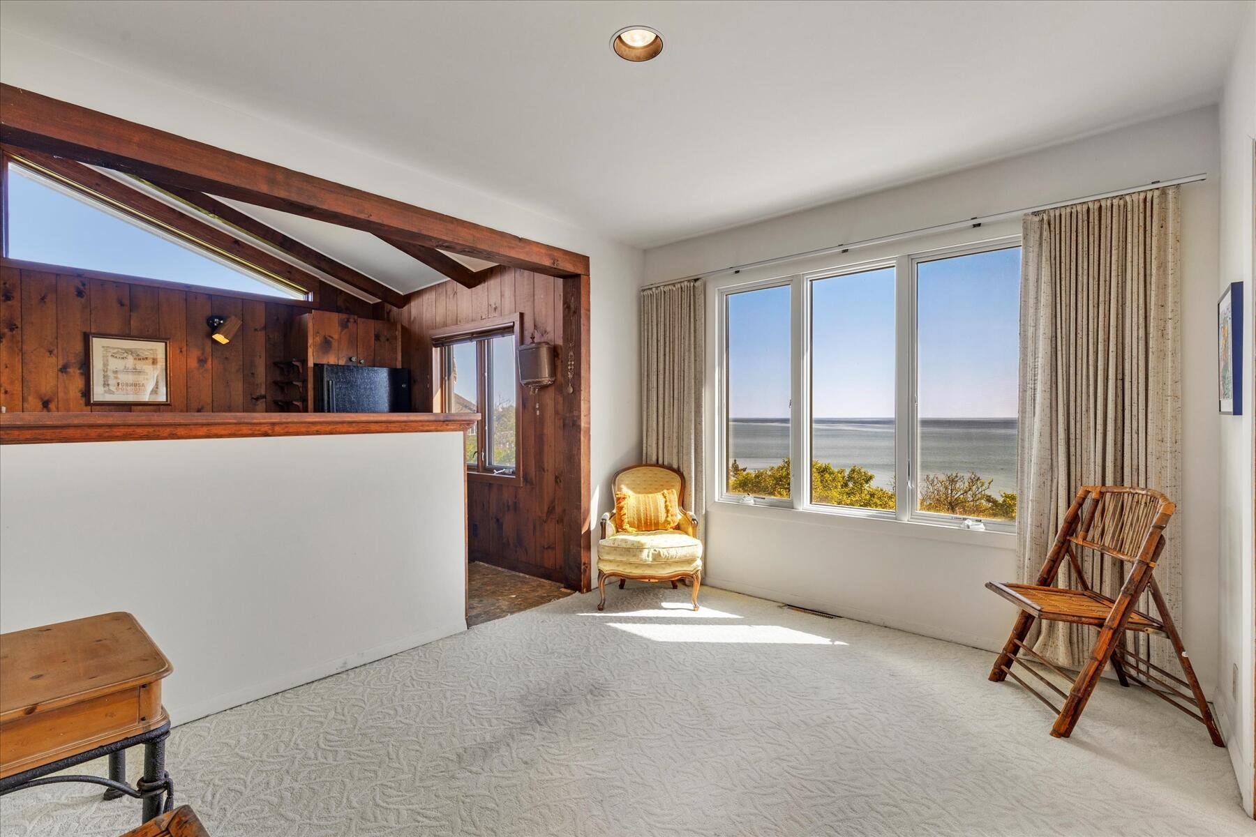 31 Bay View Road Truro, MA 02666 - Photo 10 of 54 a living room with furniture and a window