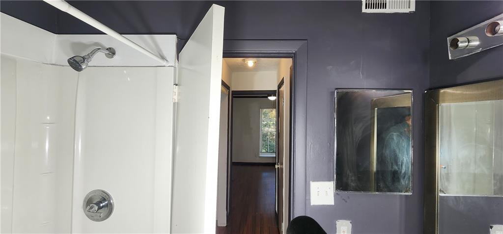 2805 Ne Expressway, Unit B36 Atlanta, GA 30345 - Photo 21 of 29 a bathroom with a mirror and a shower
