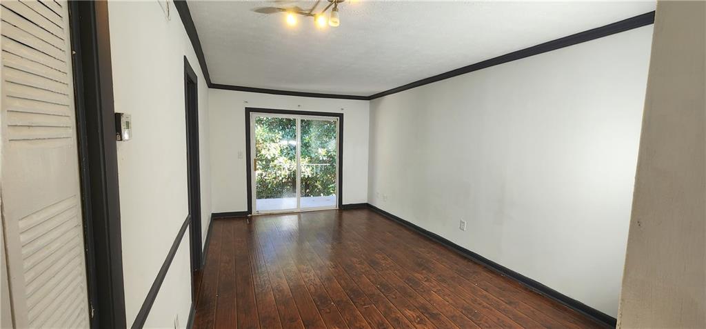2805 Ne Expressway, Unit B36 Atlanta, GA 30345 - Photo 3 of 29 a view of an empty room with wooden floor and a window