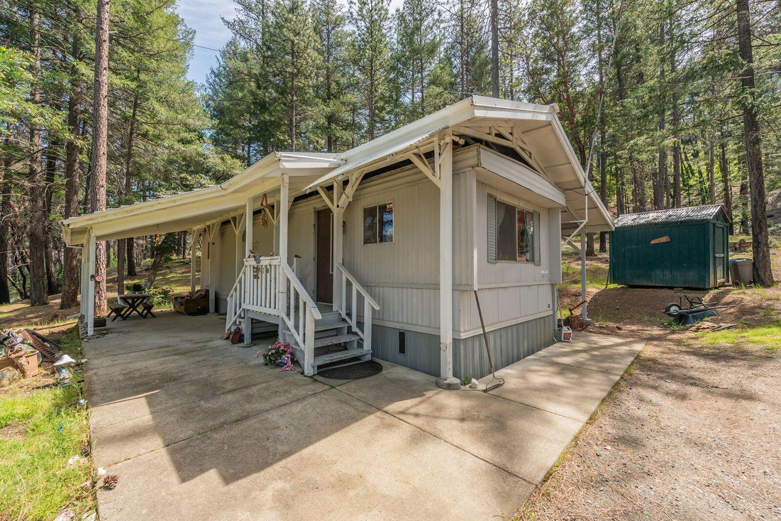 710 Dutch Creek Road Junction City, CA 96048 - Photo 3 of 38 a view of a house with a yard and large trees