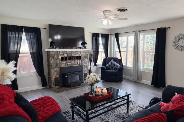 a living room with furniture and a fireplace