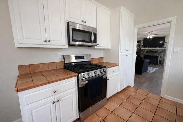 a kitchen with a stove and a microwave