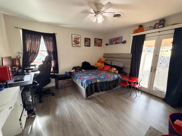 a bedroom with bed and a window