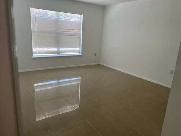 a view of empty room with a window