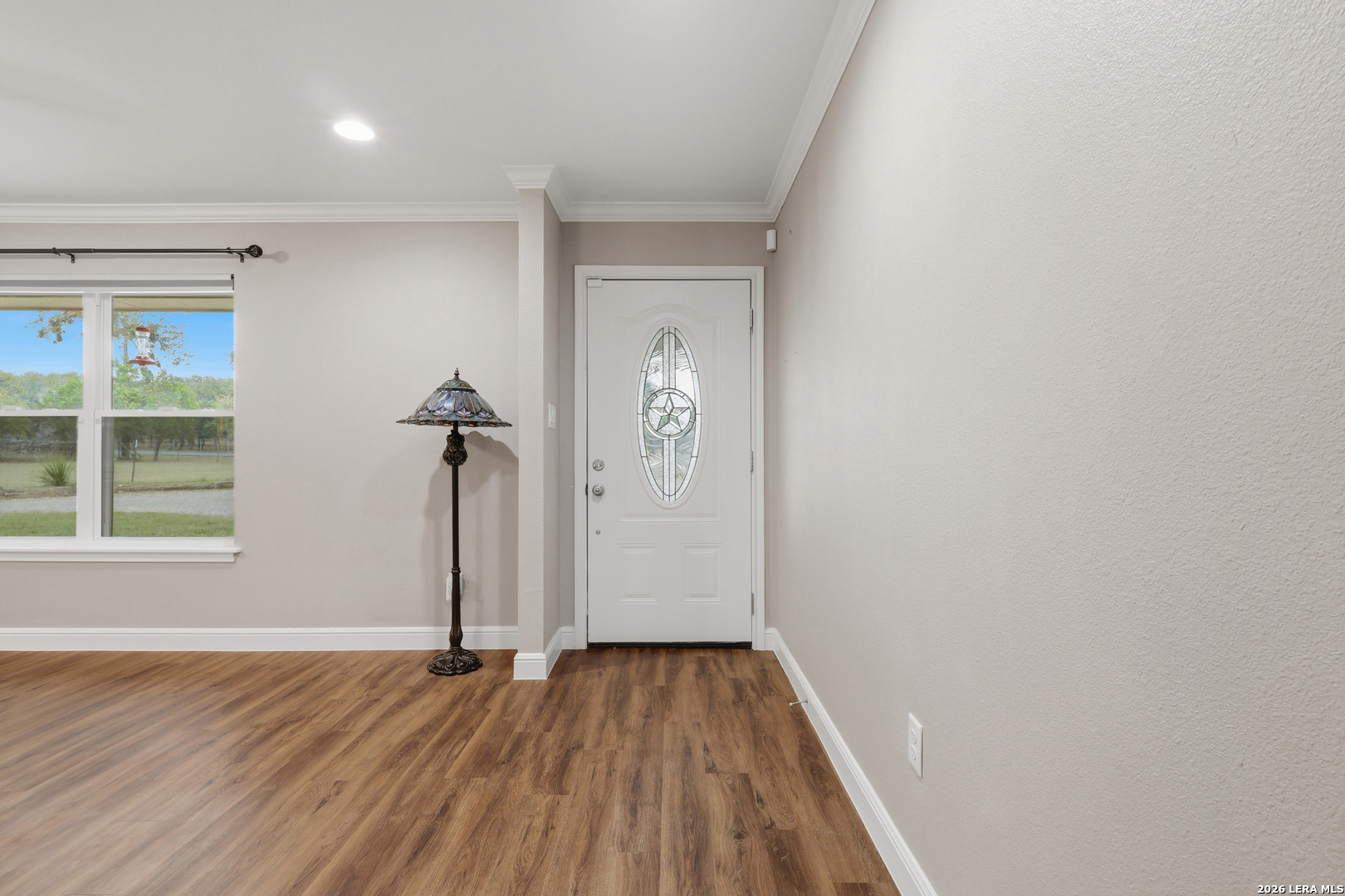 30511 Oakview Road Bulverde, TX 78163 - Photo 2 of 35 a view of an empty room with wooden floor and a window