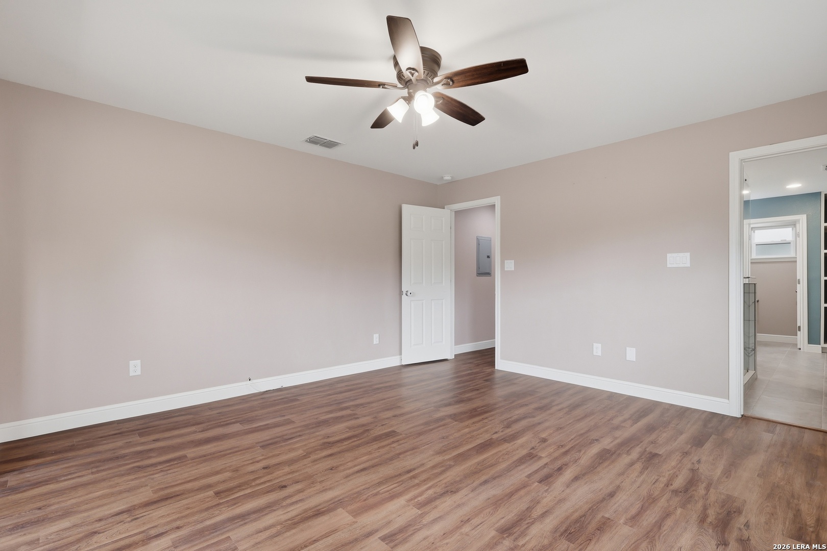 30511 Oakview Road Bulverde, TX 78163 - Photo 21 of 35 a view of an empty room with wooden floor