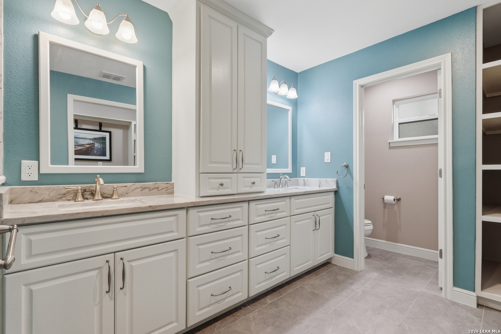 30511 Oakview Road Bulverde, TX 78163 - Photo 22 of 35 a bathroom with double sink and a mirror