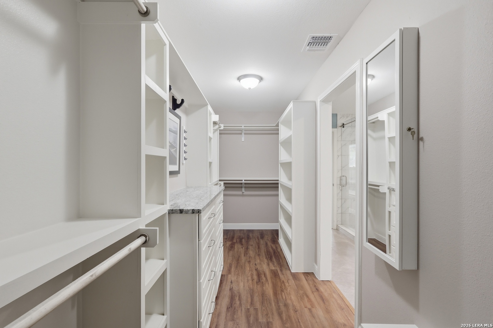 30511 Oakview Road Bulverde, TX 78163 - Photo 24 of 35 a view of walk in closet with wooden floor