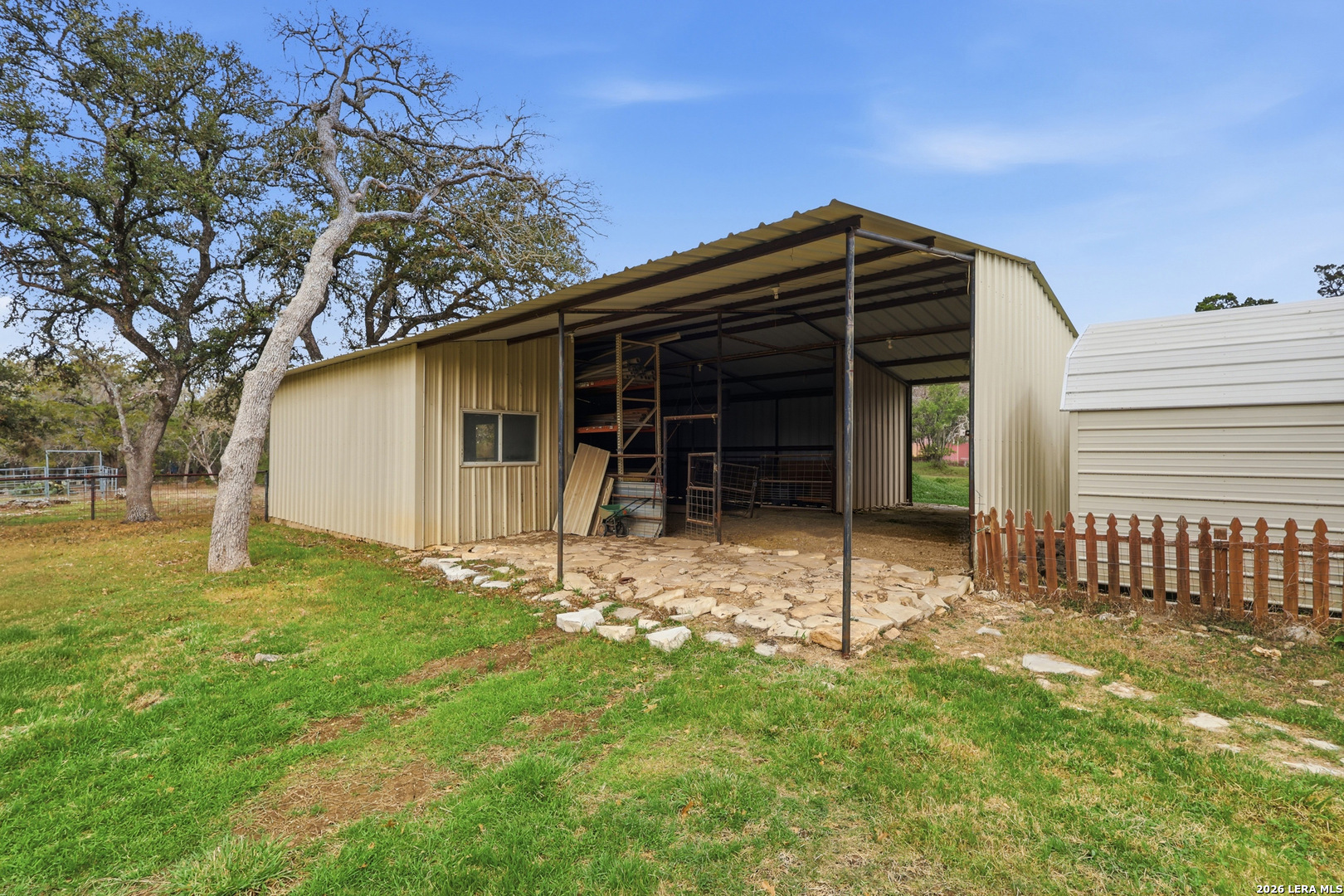 30511 Oakview Road Bulverde, TX 78163 - Photo 26 of 35 a view of a house with a backyard