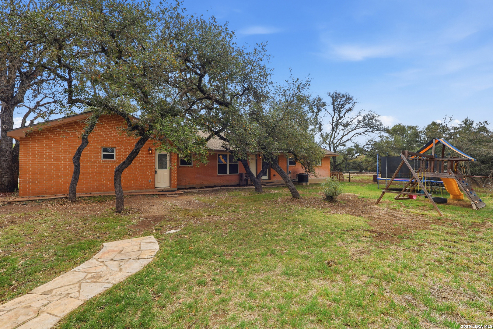 30511 Oakview Road Bulverde, TX 78163 - Photo 27 of 35 a view of a playground with a yard