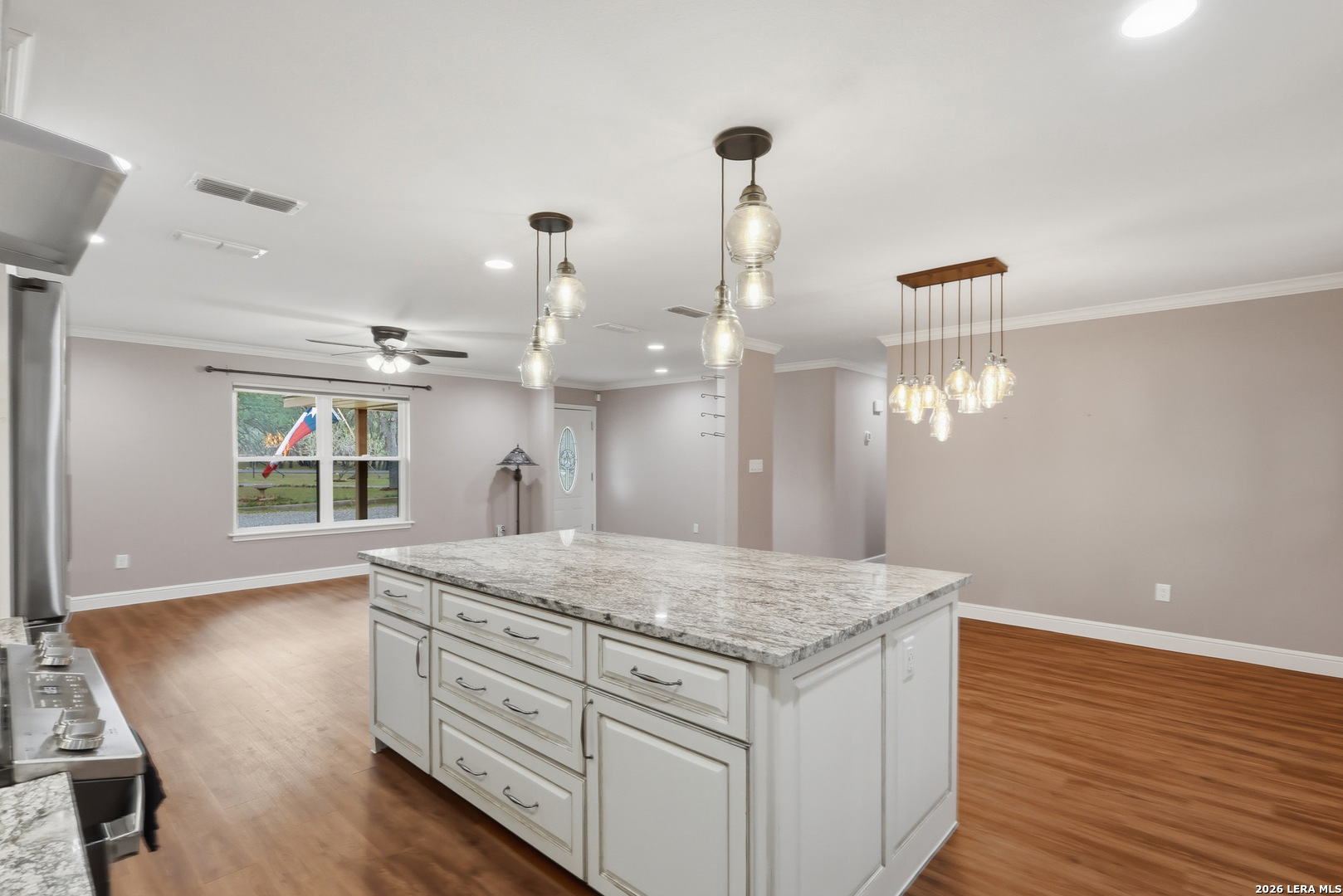 30511 Oakview Road Bulverde, TX 78163 - Photo 9 of 35 a view of a kitchen counter space and wooden floor