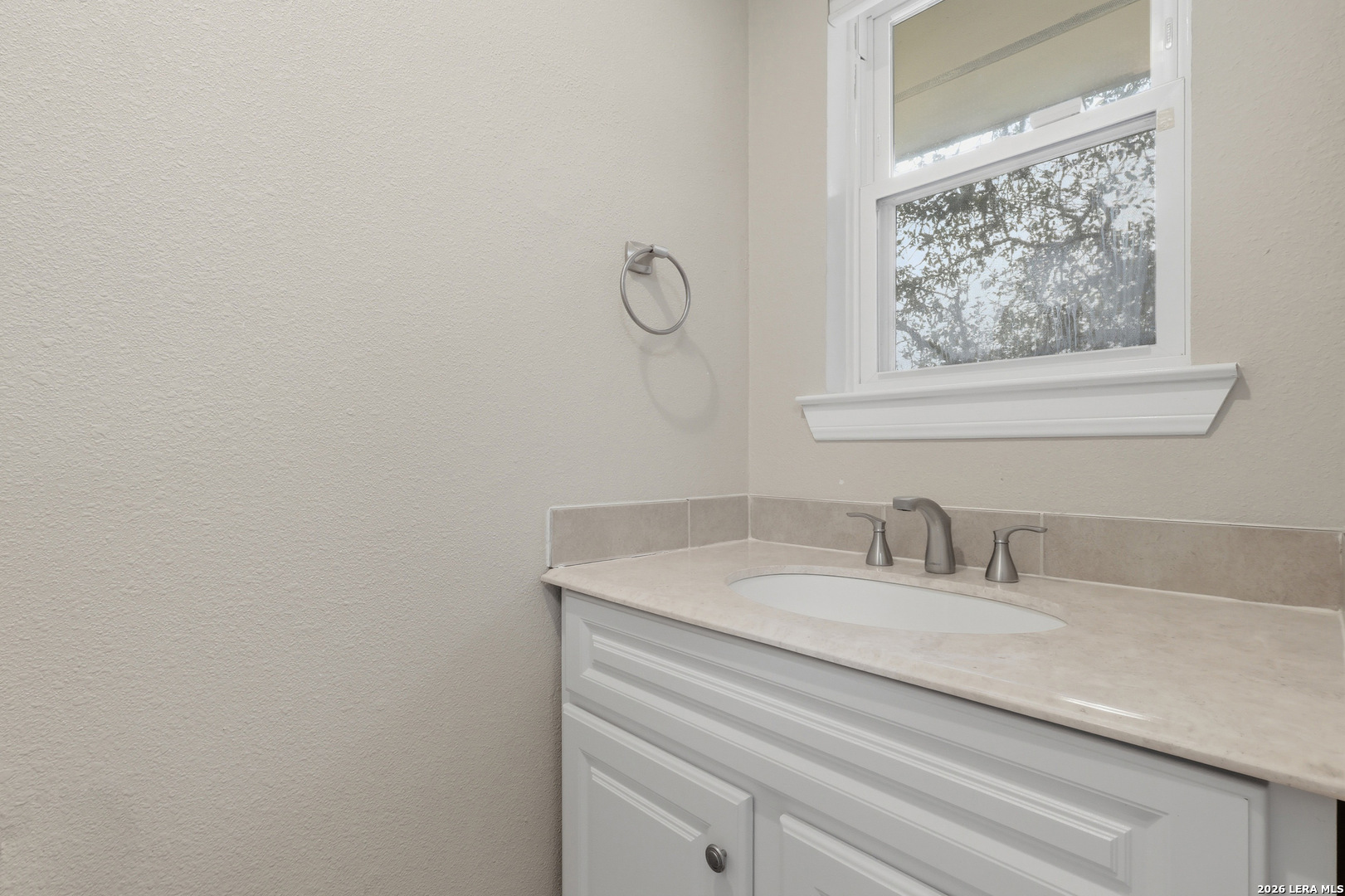 30511 Oakview Road Bulverde, TX 78163 - Photo 10 of 35 a bathroom with a sink and a mirror