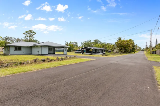 a house with swimming pool in front of it