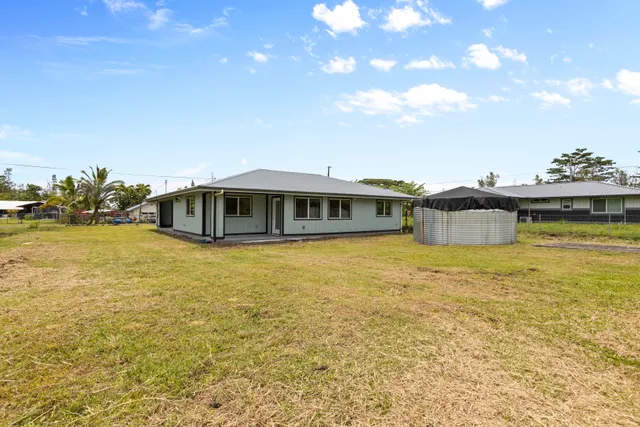 a front view of a house with a ocean view