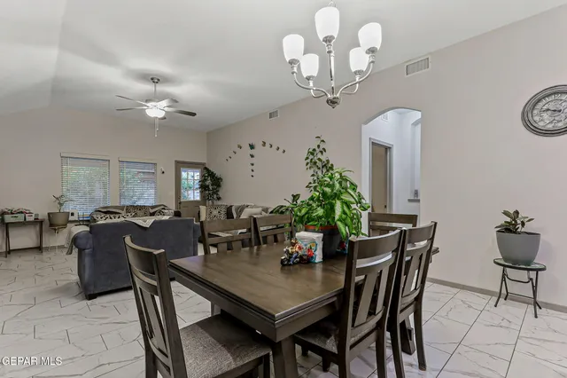 a bathroom with a toilet and a shower curtain