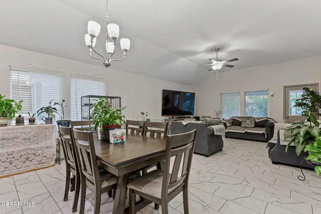 a bedroom with a bed and a television