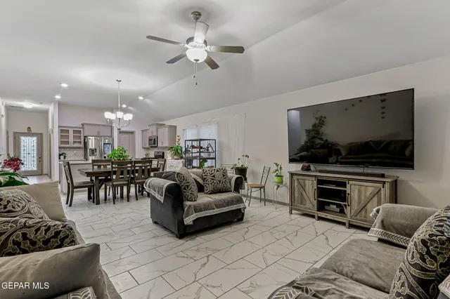 a view of a porch with a table and chairs