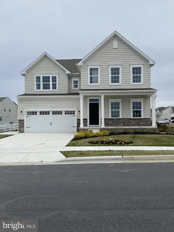 a view of multiple houses with a street