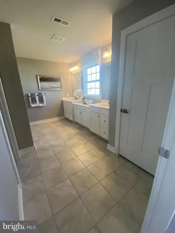 a bathroom with a toilet and a sink