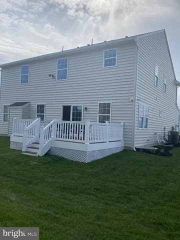 a living room with a bed furniture and a window