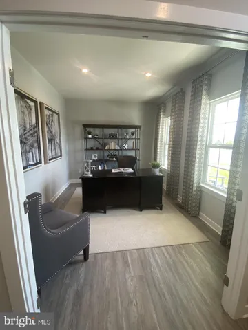 a spacious bedroom with a bed and a window