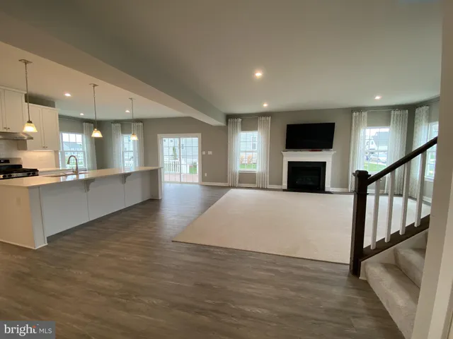 a view of kitchen with furniture and a fireplace