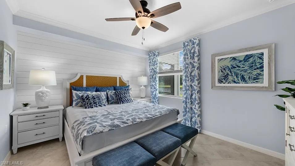15285 Grn Acrs Avenue, Unit 428 Babcock Ranch, FL 33982 - Photo 6 of 11 Bedroom featuring light tile patterned floors, a ceiling fan, baseboards, and ornamental molding