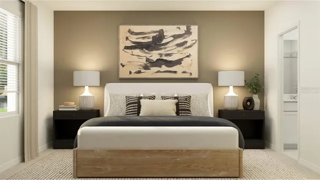 a bedroom with a bed and a lamp