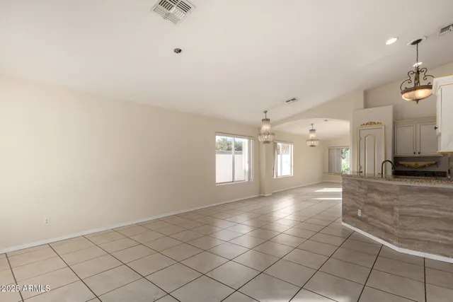 a view of a hallway with chandelier