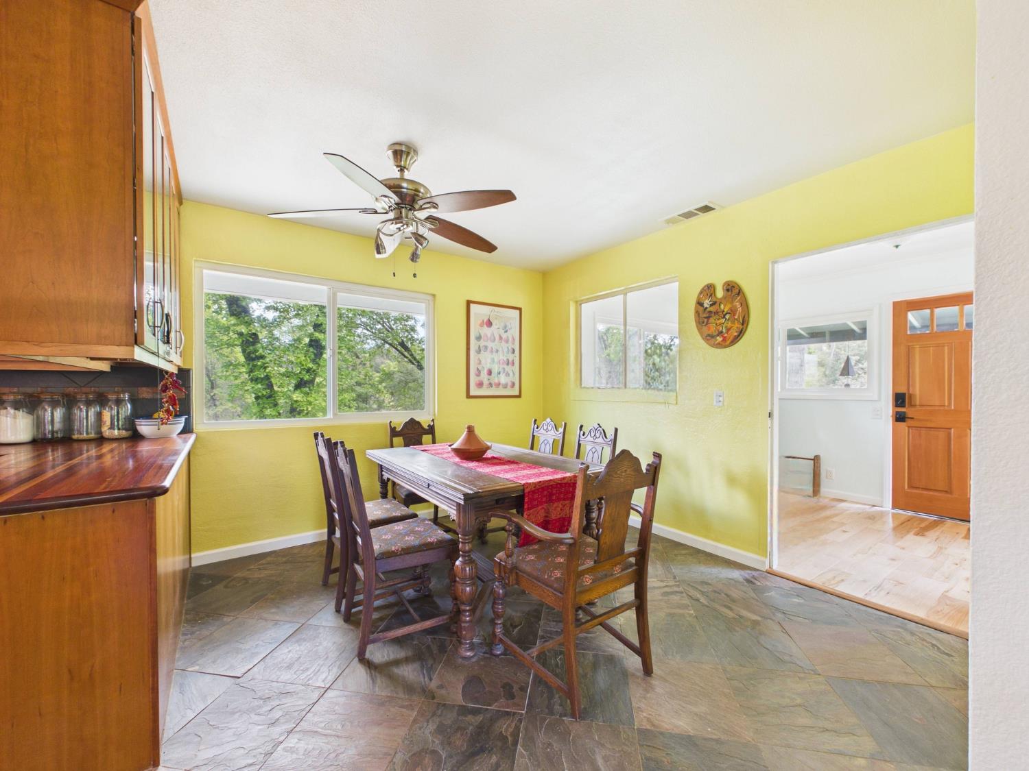 37777 China Creek Road Oakhurst, CA 93644 - Photo 18 of 64 a view of a dining room with furniture window and outside view