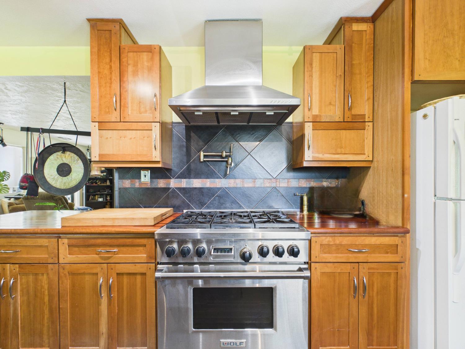 37777 China Creek Road Oakhurst, CA 93644 - Photo 22 of 64 a stove top oven sitting inside of a kitchen